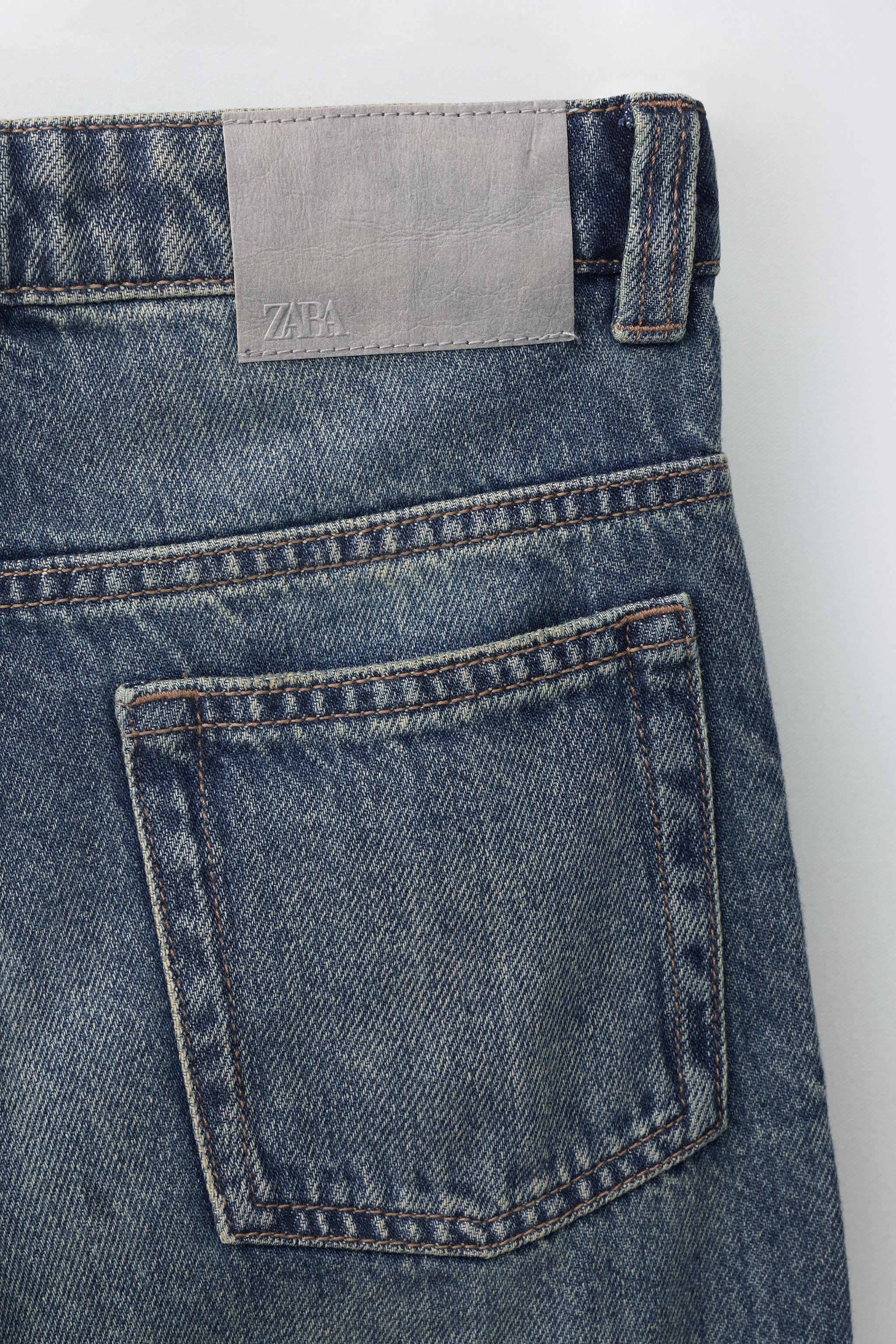 FLARE FIT FRAYED JEANS